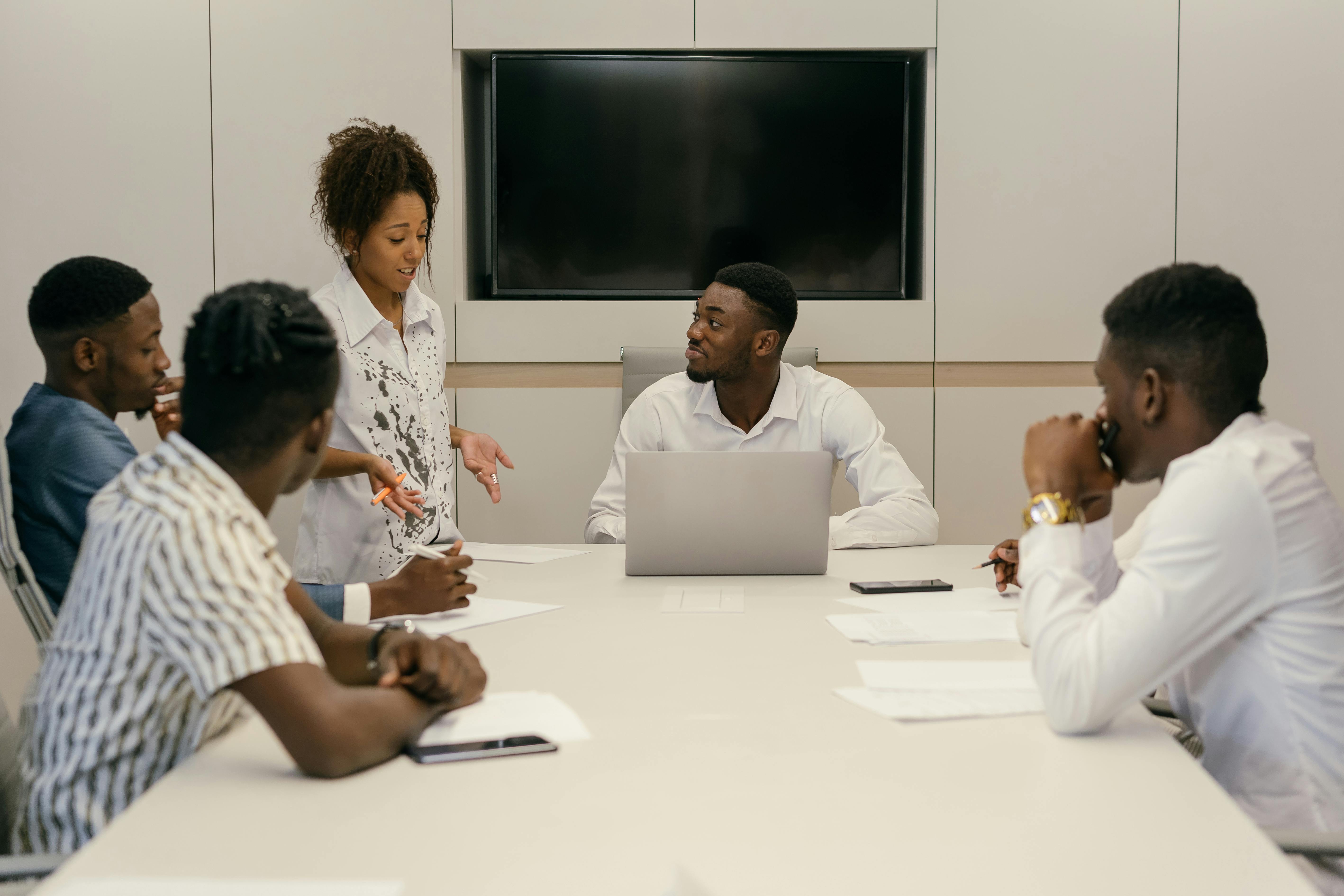 Professional African team collaborating in meeting